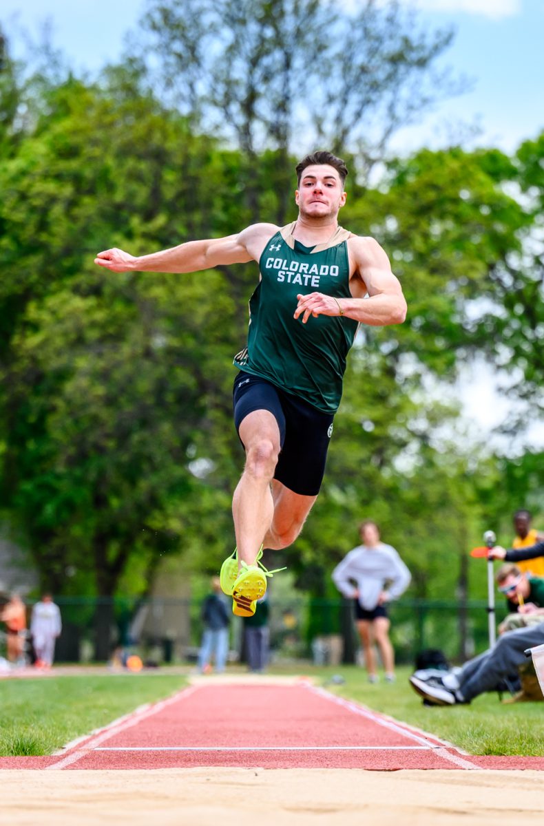 Colorado State University track and field athlete Mateo Munoz leaps into the long jump sand pit during CSU's Border Dual Meet April 25. Munoz placed first with a mark of 6.82 meters.