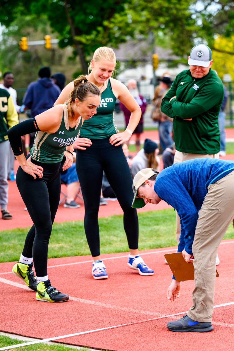 Colorado State University track and field athlete Mackenzii Phillips watches Jet Van Der Heijden's 49.60 meter javelin throw get marked during CSU's Border Dual Meet April 25.