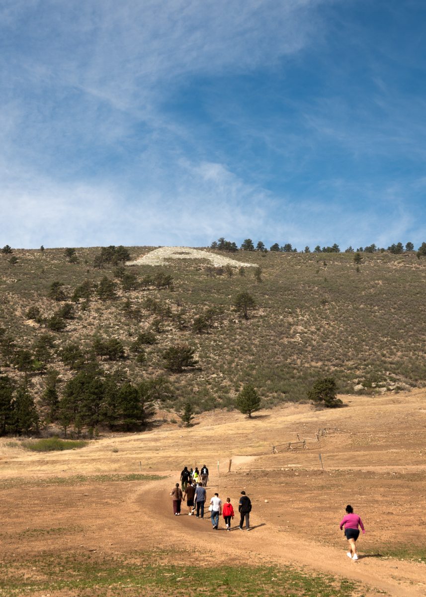 Members of Colorado State University's Community for Excellence group walk down the Maxwell Natural Area trail on the way to The A April 11. The Community for Excellence works with several other staff and student groups at CSU, including the Access Center and Academic Advancement Center, to provide resources and scholarship opportunities for students. It was started by the Transition Coordinating Committee in 2010.
