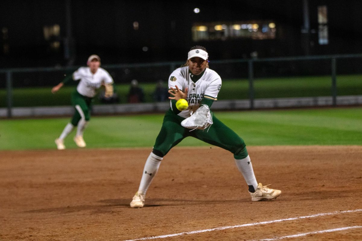 Softball player catches the ball during play against Grand Canyon University on April 30.