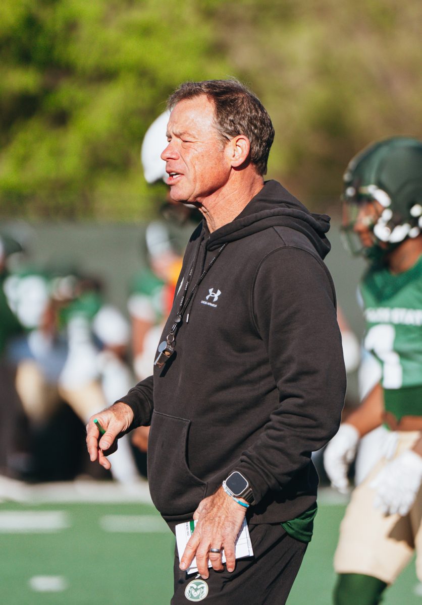 Jim Mora, head coach for the Colorado State Football team, directs players during practice Apr. 7.