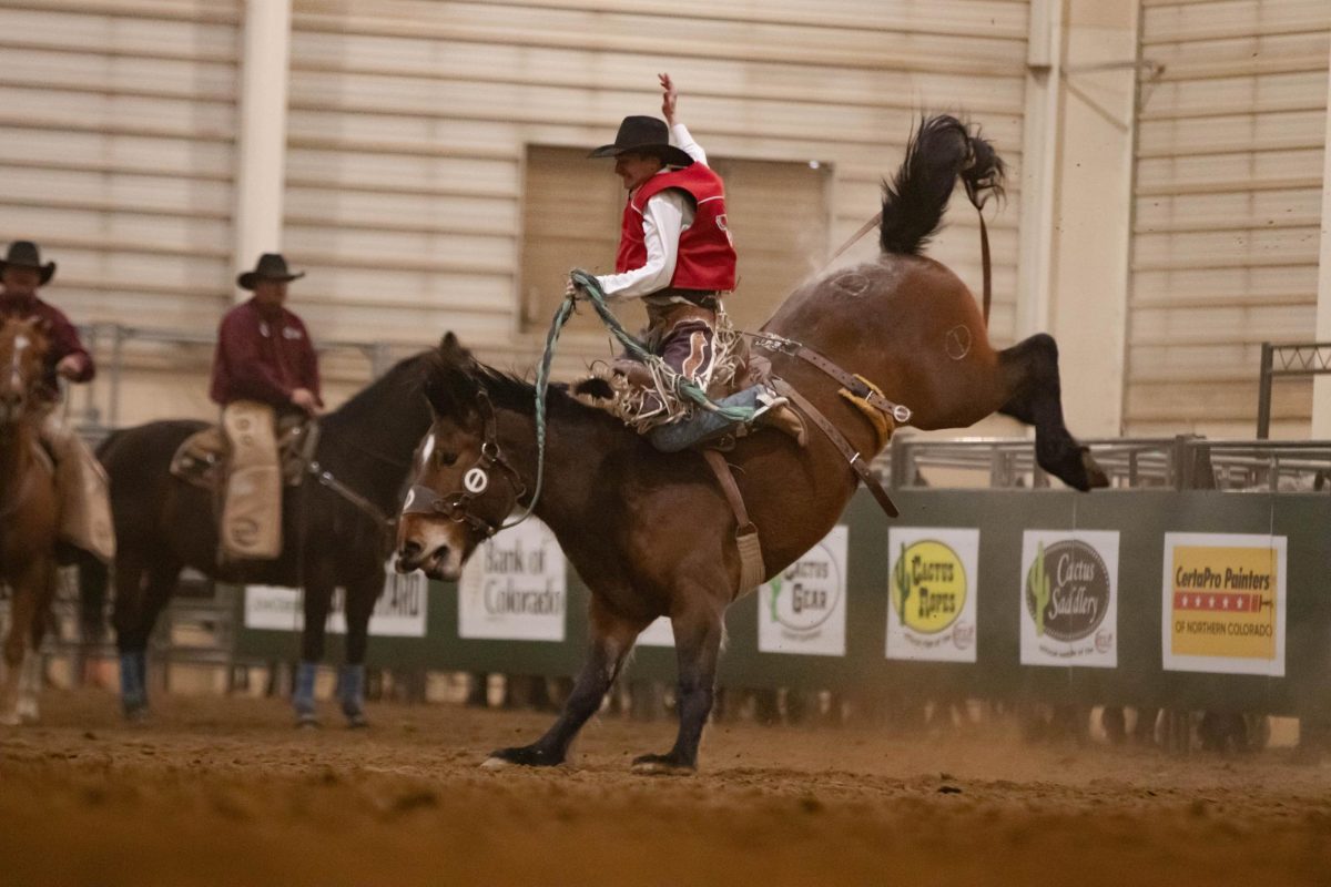 A saddle bronc rider competes at Colorado State University's 76th annual Skyline Stampede Rodeo at The Ranch Events Complex April 3.