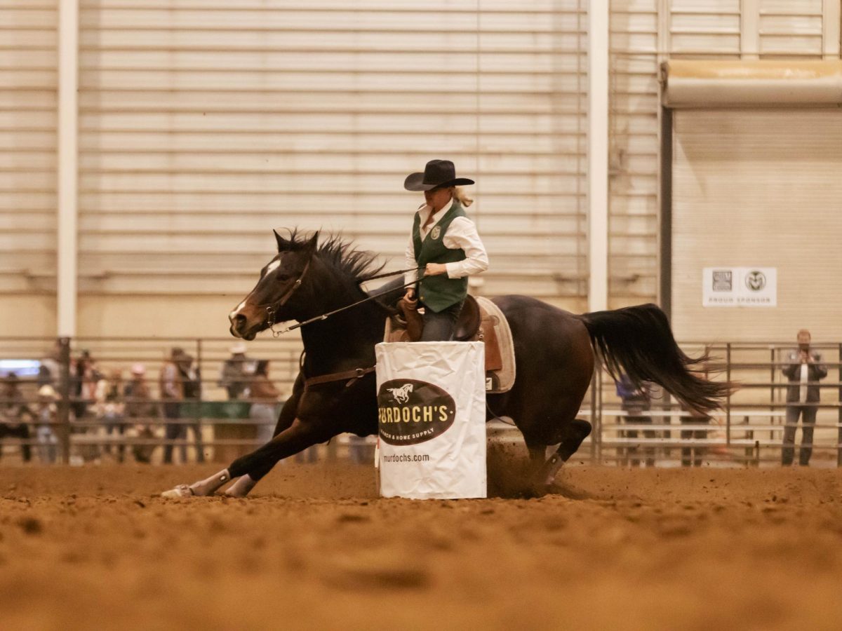 Barrel racer Avery Hanggi turns the barrel at Colorado State University's 76th Annual Skyline Stampede Rodeo at The Ranch Events Complex April 3.