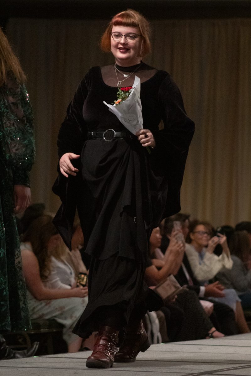 Kiara Sparks, a senior in apparel design and production, walks onto the runway to be recognized, after the conclusion of Fashion Reframed, Colorado State University Design and Merchandising department’s annual student-run fashion show in the Lory Student Center ballrooms May 1. Sparks’ collection Form and Flesh won Best Construction, and was “inspired by the human body, balancing storytelling with wearable clothing.”