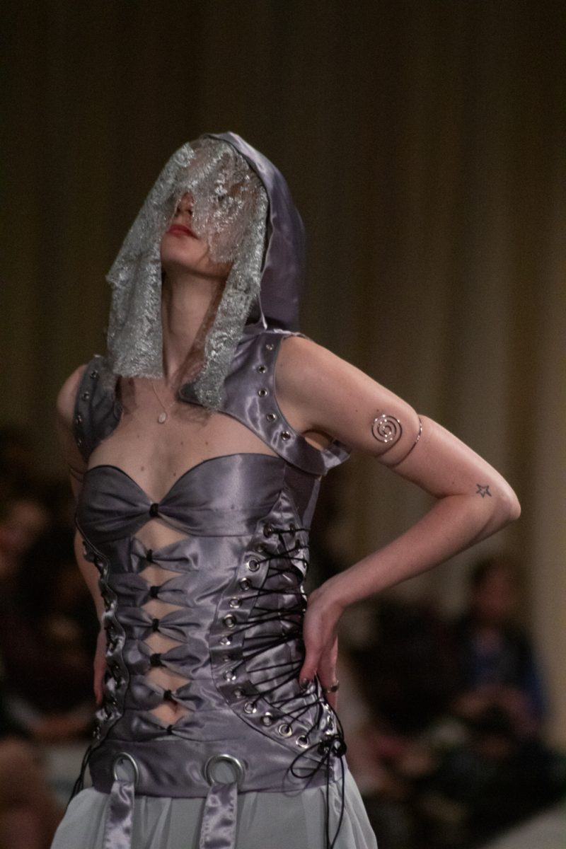 A student models a look designed by Amy Moore a senior in apparel design and production, as part of her collection Fragments of Melancholy during Fashion Reframed, Colorado State University Design and Merchandising department’s annual student-run fashion show in the Lory Student Center ballrooms May 1. Moore’s collection “represents the five stages of grief through layeres silhouettes, textures, and a soft restrained color palette. The collection is a personal reflection on loss, resilience, and healing…”