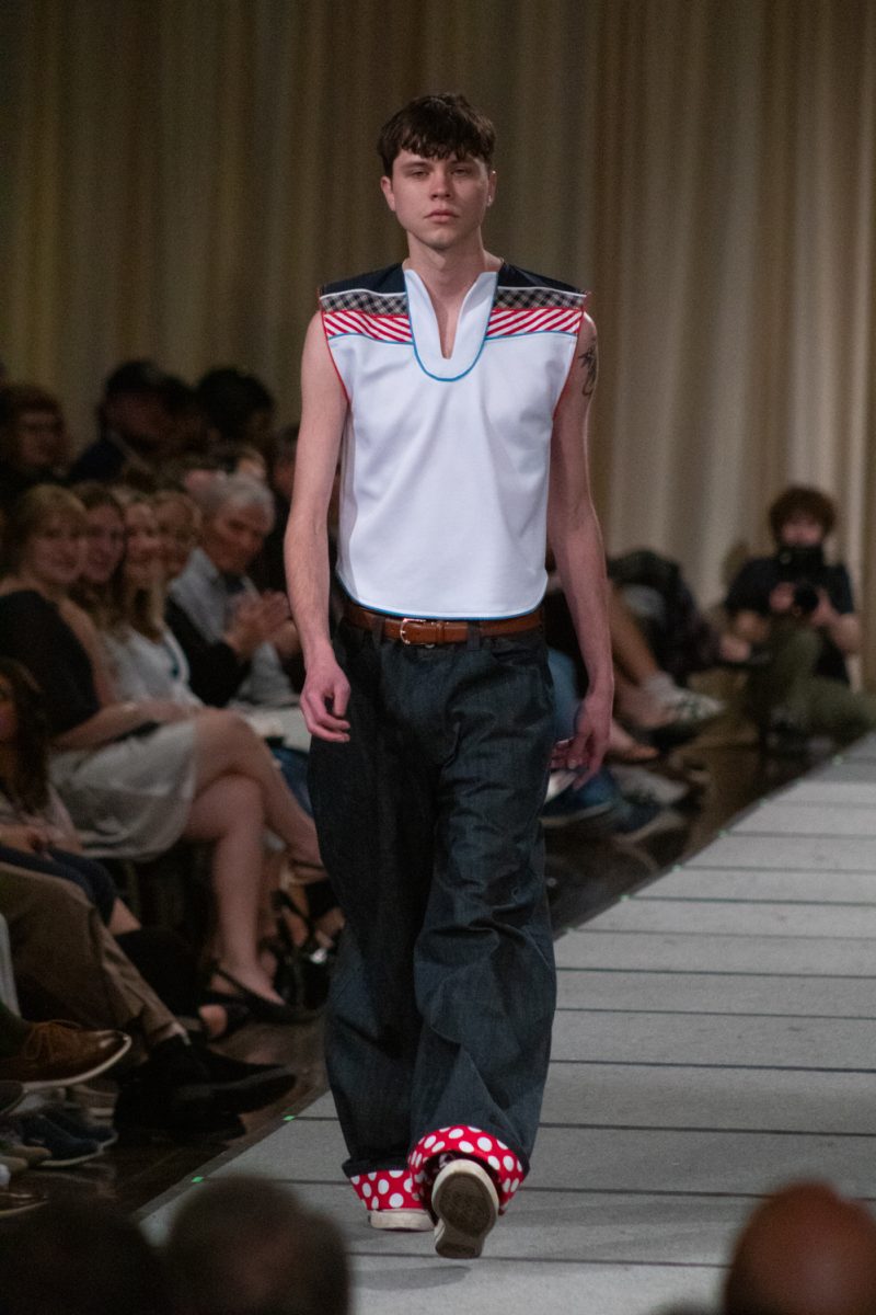 A model walks down the runway wearing a look designed by Logan Mourek, a senior in apparel design and production, as part of his collection Boyz Boyz Boyz during Fashion Reframed, Colorado State University Design and Merchandising department’s annual student-run fashion show in the Lory Student Center ballrooms May 1. This collection won Most Marketable, and “reflects the ever-shifting mindset of a modern male coming of age through a diverse collection of clothing.”
