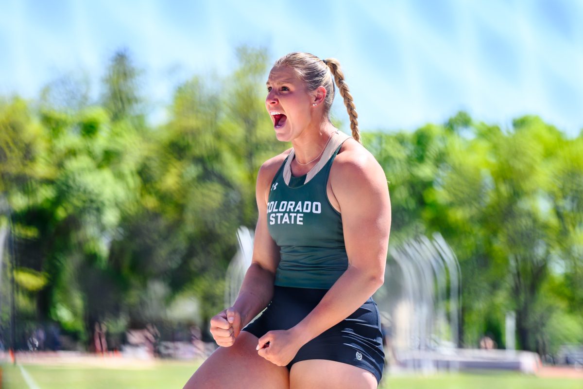 Colorado State University Track and Field athlete Makayla Long yells in celebration with her teammates after a successful discus throw during the Doug Max Invitational May 2. Long placed second with a mark of 53.14 meters.