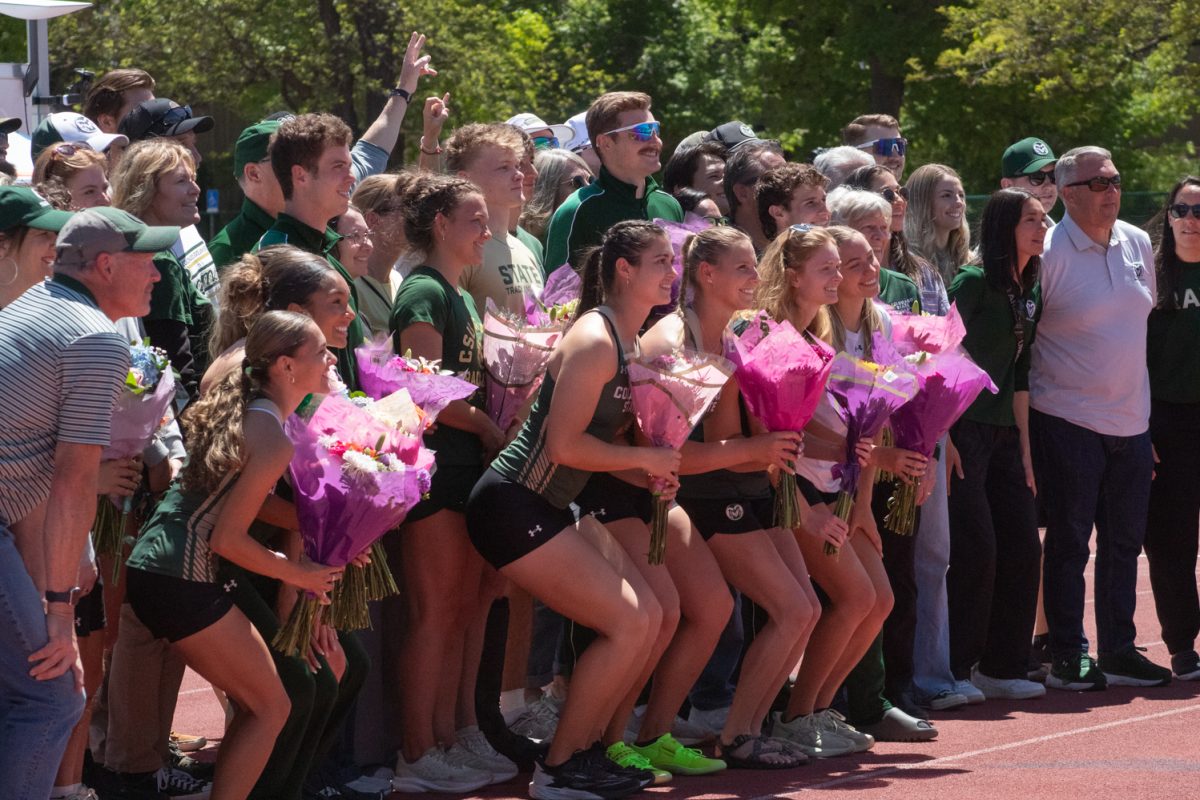 Colorado State University Track and Field seniors pose with their family members for a group photo during CSU’s Doug Max Invitational May 2.