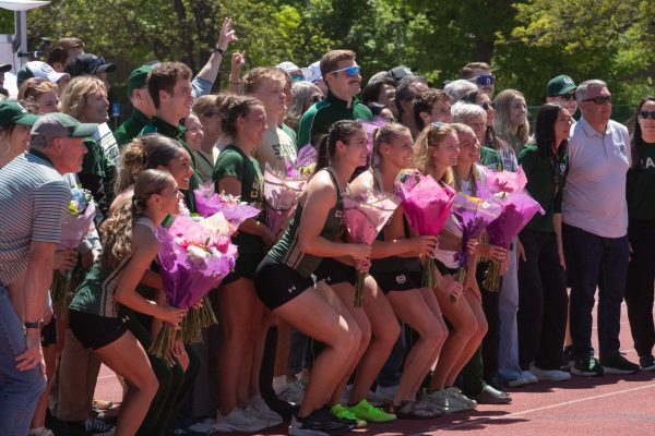 Colorado State University Track and Field seniors pose with their family members for a group photo during CSU’s Doug Max Invitational May 2.