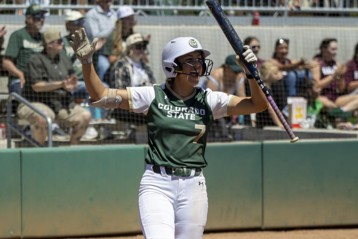 Autumn Rutherford (7) cheers for teammate 
Jailey Wilson's (10) home run. The Rams played Grand Canyon University at the CSU softball field May 2nd.