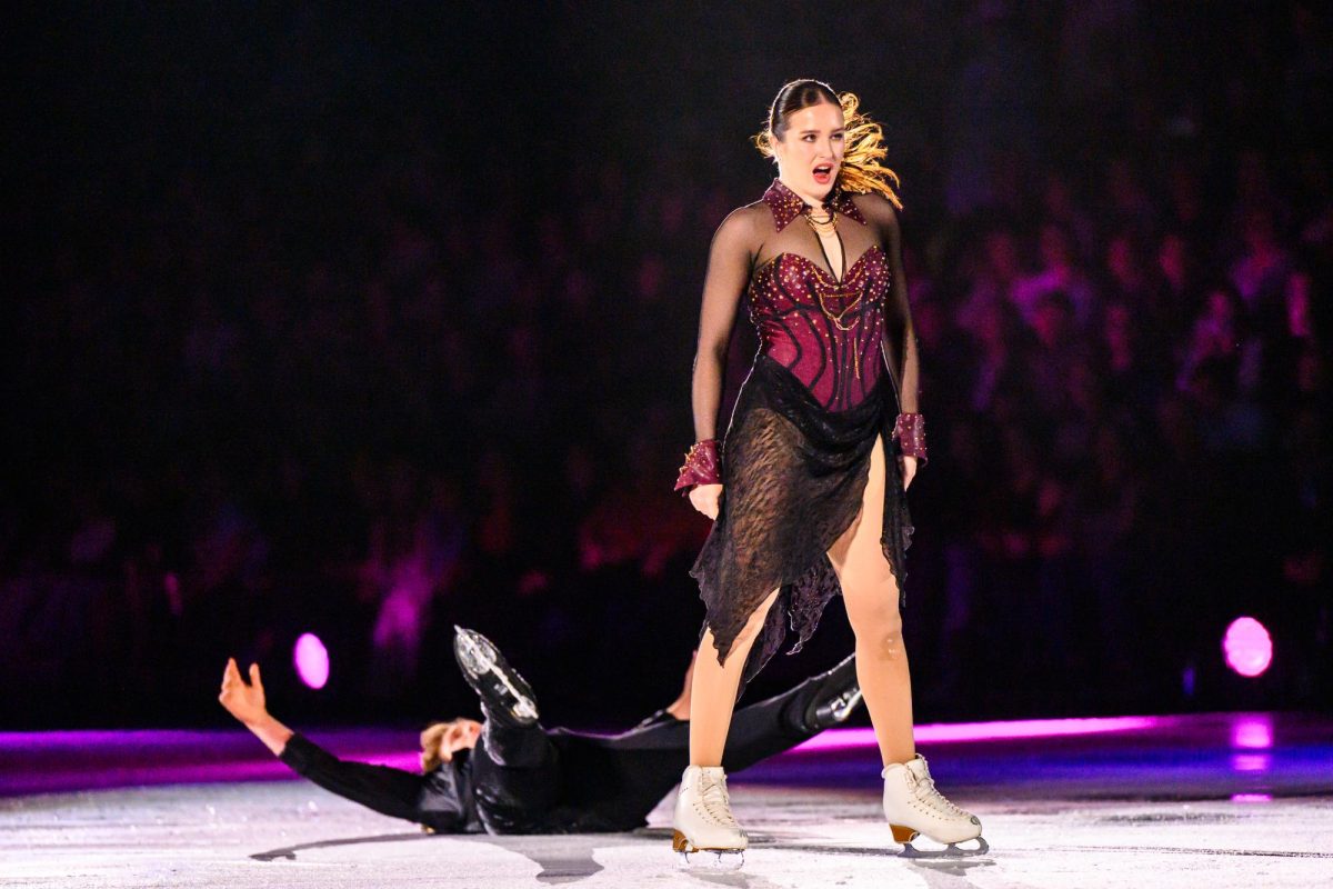 United States silver medalist Christina Carreira stands over her skating partner Anthony Ponomarenko during their first number of the Stars on Ice show in Loveland, CO May 12. The team ended their routine to Maneater by Nelly Furtado and Carreira dragged Ponomarenko across the ice.