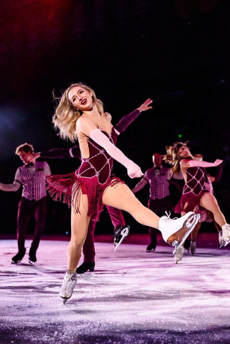 Olympic gold medalist Amber Glenn dances in a group number with the United States Olympic skating team and cast of the Stars on Ice show in Loveland, Colorado May 12.