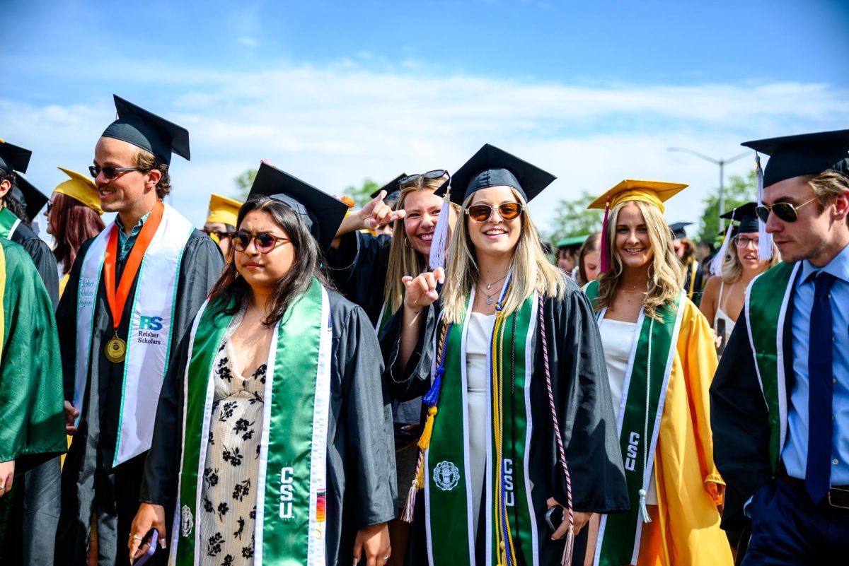 Colorado State University graduates pose for a photo before the Universitywide Commencement ceremony in Canvas Stadium May 16.