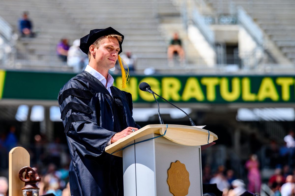Colorado State University commencement speaker Hunter Powell, a 2026 United States Olympic athlete, looks out at the crowd during his speech May 16. Powell graduated from CSU in 2019. 