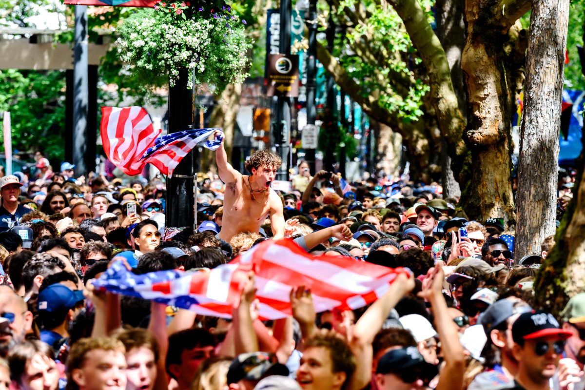 United States Men's National Tournament soccer fans pack into Pioneer Square, Seattle, to watch the United States' FIFA World Cup match against Australia in Seattle Stadium June 19. While high ticket prices and limited seats kept many fans from being able to get into the stadium, watch parties were held across the city for each of the six matches in Seattle. 