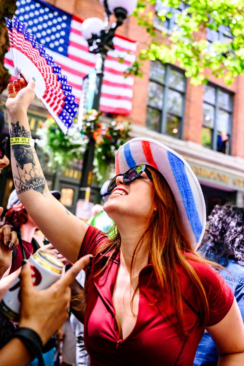 A United States Men's National Tournament fan cheers in Pioneer Square after the USMNT's win against Australia in their FIFA World Cup group match in Seattle June 19. Thousands of soccer fans gathered in watch parties outside the stadium in areas like Victory Hall in Sodo and Waterfront Park on Elliot Bay. 
