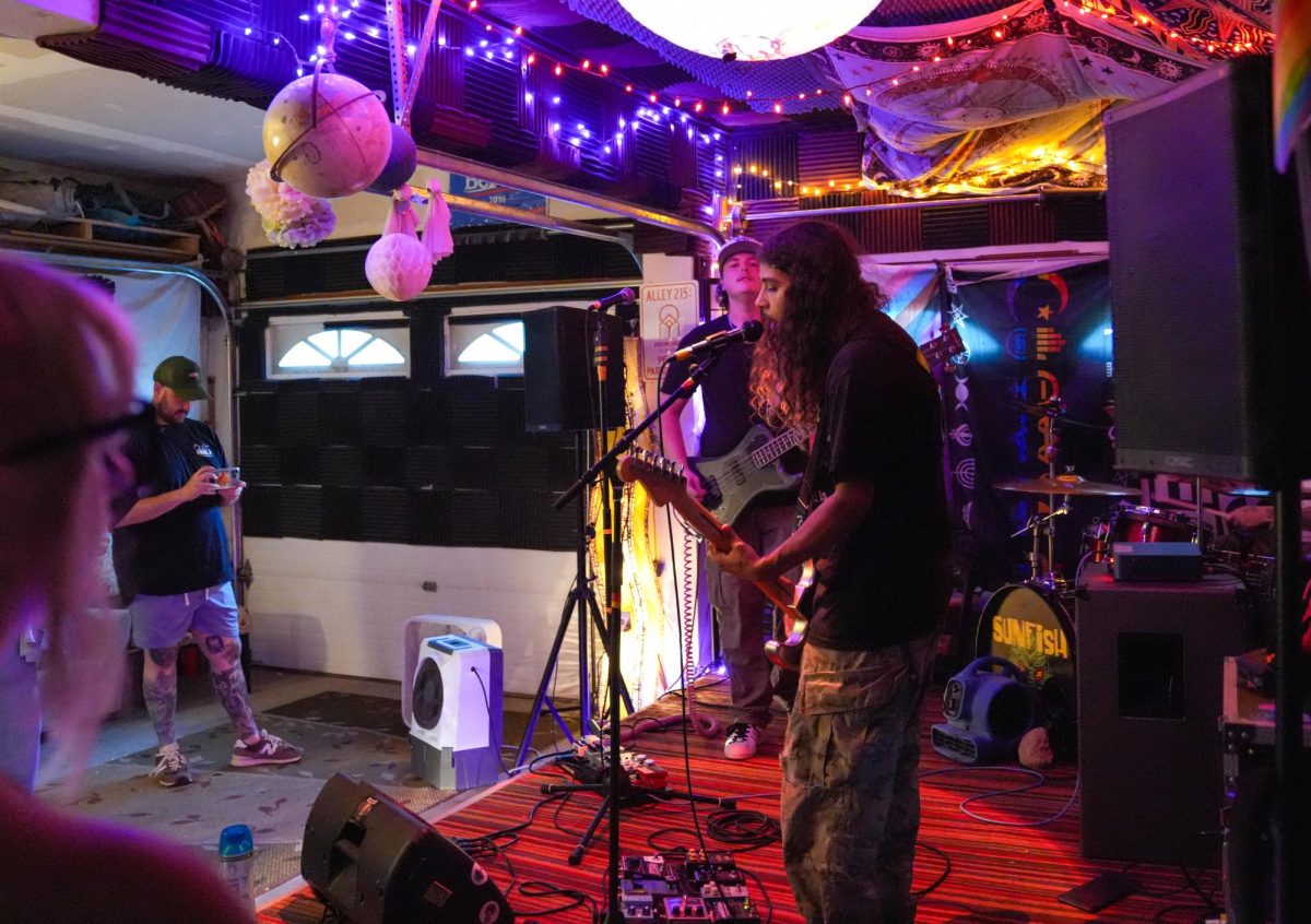Isahen Harms talks to the crowd after him and the band, Ivory Daze, performed their first song of the evening July 5.