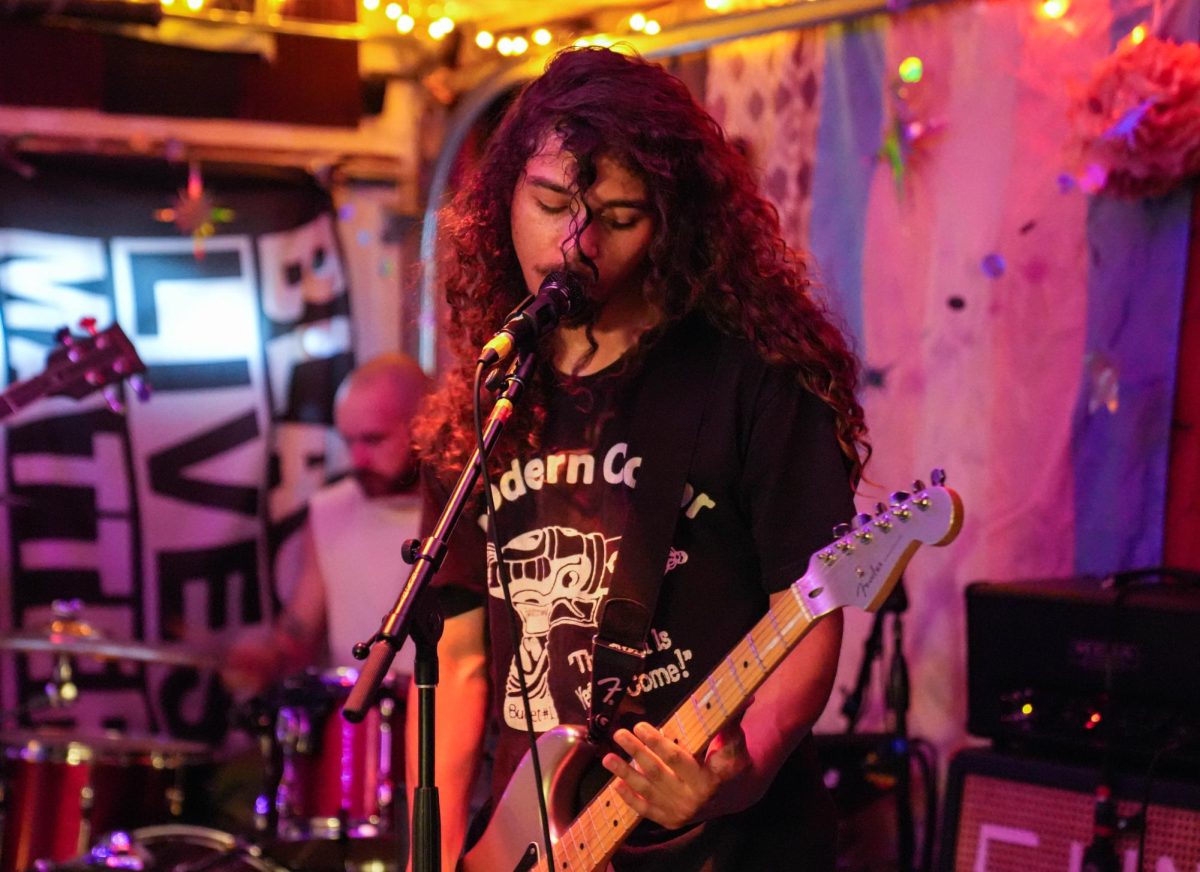 Isahen Harms sings during Ivory Daze's setlist July 5. Ivory Daze performed in a garage concert that was made possible by The Sun Spot.