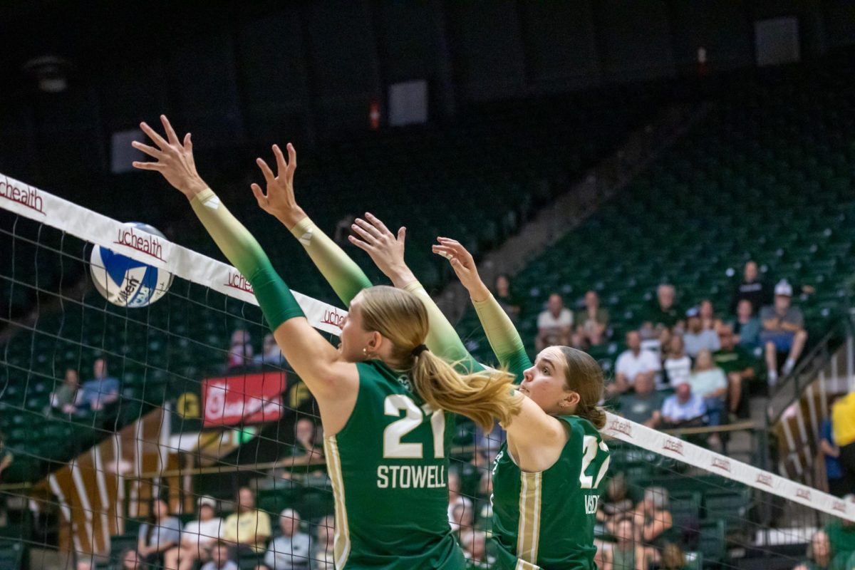 Ella Stowell (21) and Eve Wilson (27) go up to block at the net Aug. 28. Colorado State University volleyball played University of California, Davis at Moby Arena and won 3-0.