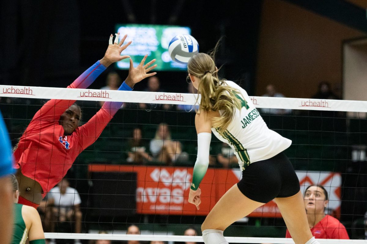 Halle Jameson (4) hits the ball against an SMU block Aug. 29. CSU played SMU at Moby Arena, falling 3-1.