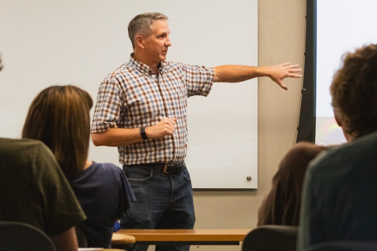 Jake Ivan, a research scientist with Colorado Parks and Wildlife, points audience members to his presentation during his talk “Canada Lynx in Colorado: 25 years of Restoration and Research” in the Colorado State University Wagar Building Aug. 28. “You can learn a heck of a lot by tracking animals, right?" Ivan said. "Where they sleep, where they eat, where they hunt and where they’re successful."