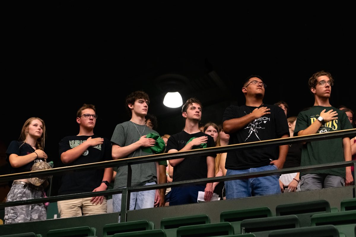 Students stand up for the Star Spangled Banner in Moby Arena Aug. 21.