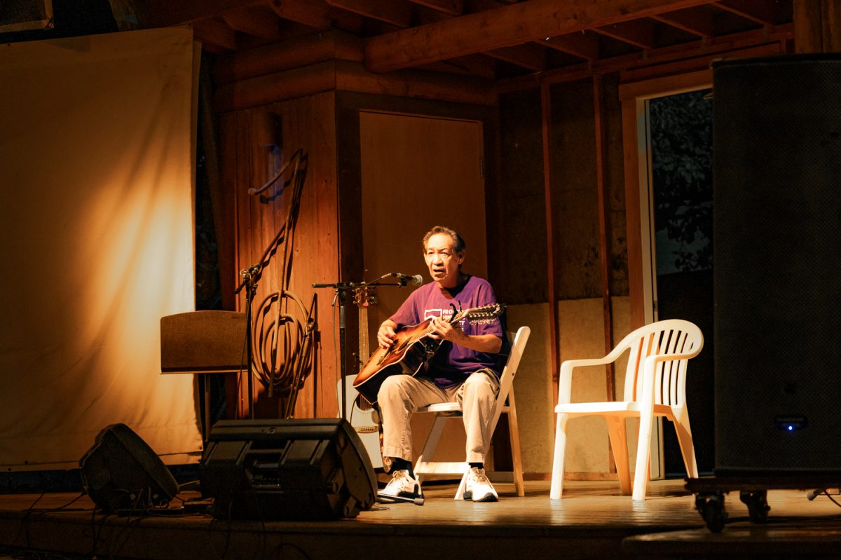 Anthony "Toni" Valadez plays the guitar for open mic night at Avogadro's Number Sept. 1.