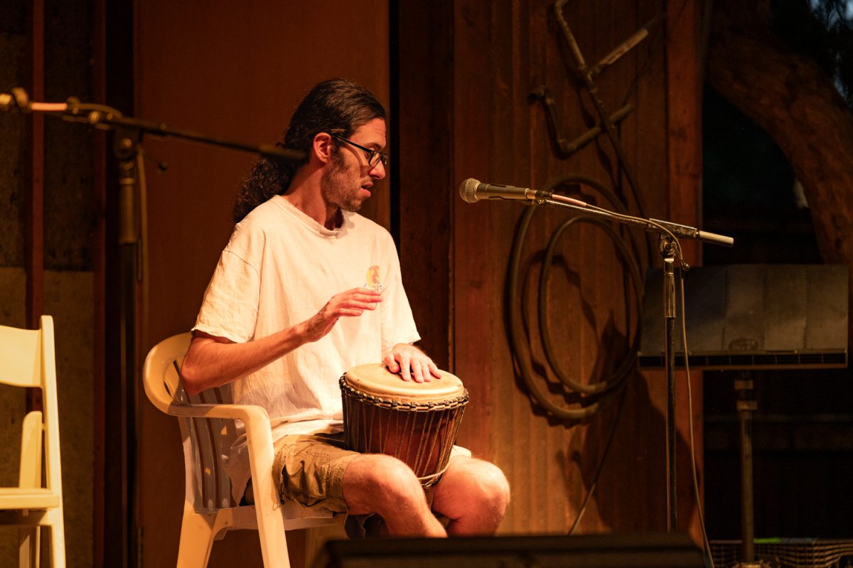 Dylan Leen, who is blind, plays the drums during open mic night at Avogadro's Number Sept. 1.