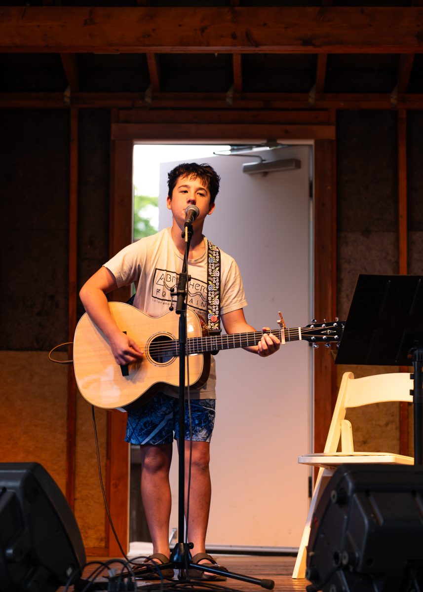Benji Rittner, first perfomer of the night plays the guitar while singing "Linda James" by Nicholas Jamerson and the Morning Jays for open mic night at Avogadro's Number Sept. 1. 
(Got Permision of parents)