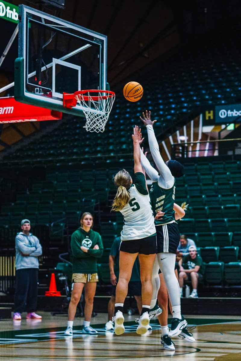Colorado State University guard Kloe Froebe (5) shoots the ball past teammate Sophie Sene (55) during morning practice in Moby Arena Sept. 22.