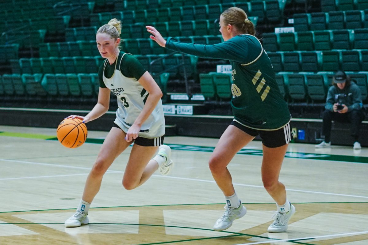 Colorado State University guard Caitlin Kramer (23) dribbles the ball past teammate Bree Bowman (10) during a practice session in Moby Arena Sept. 22.