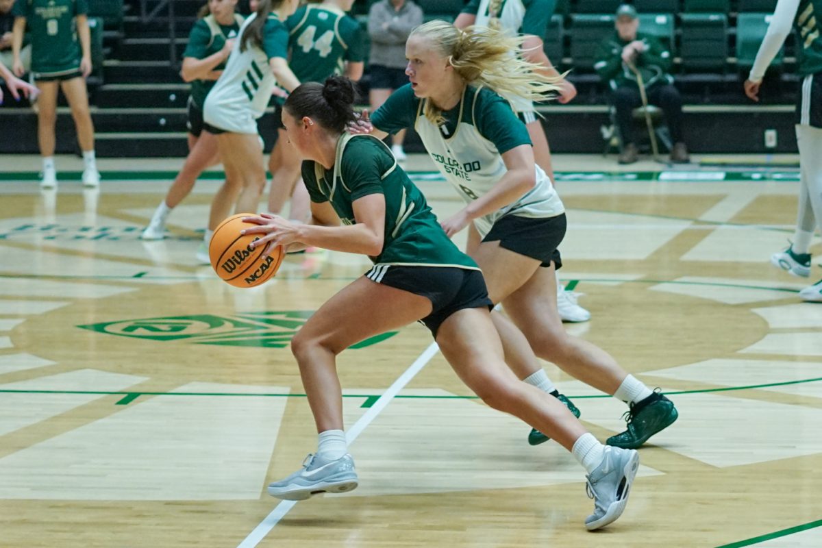 Colorado State University basketball player Gianna Smith (11) dribbles the ball under pressure from teammate Anna Wilkstrøm (8) during a practice session in Moby Arena Sept. 22.