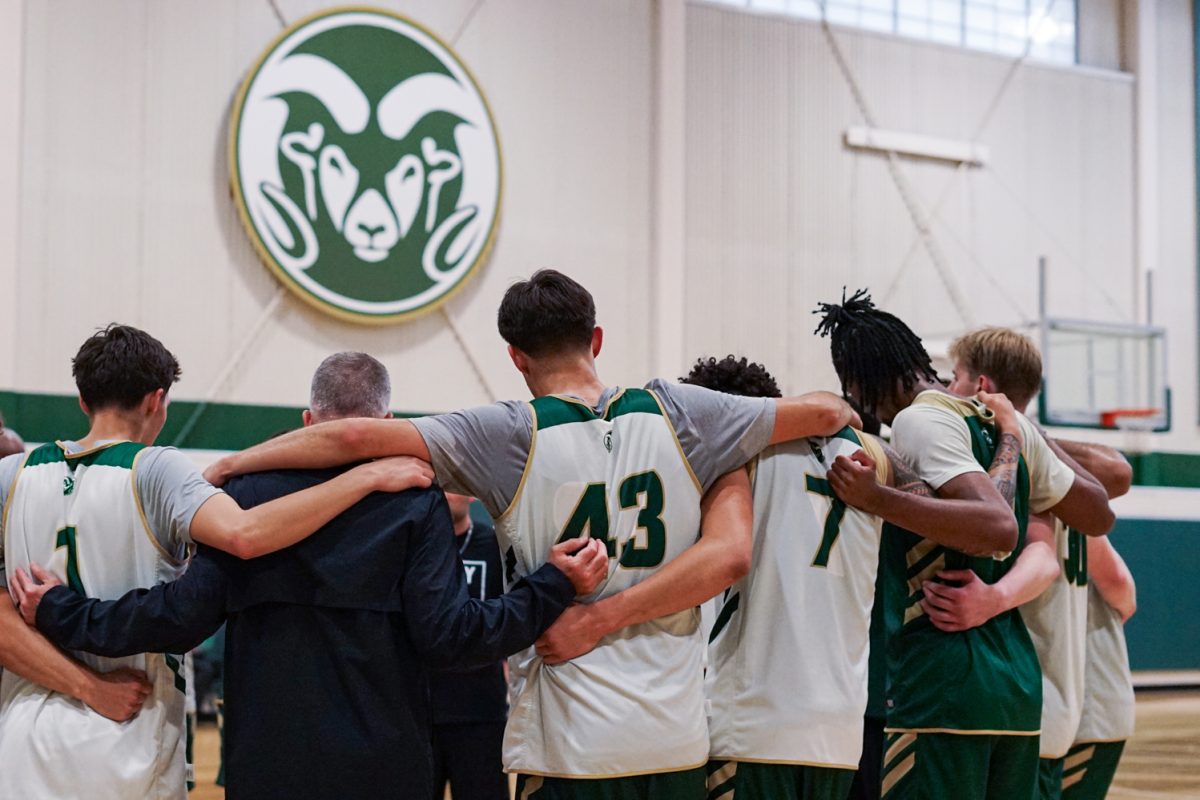 River Sawyer (1), Eric Fiedler (43), Jaden Ghoreishi (7), Carey Booth (0), and  Charlie Dortch (30) huddle up with their teammates to debrief a preseason basketball practice at the Colorado State University indoor practice facility Sept 24.