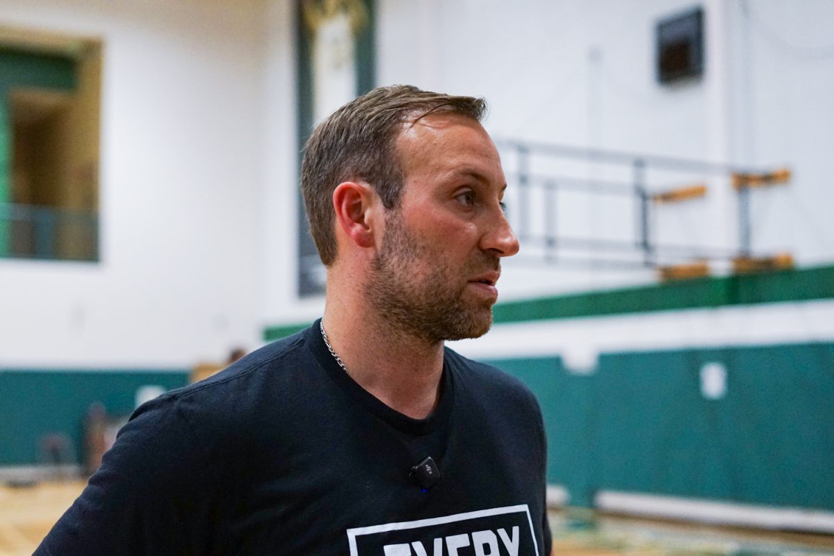 Ali Farokhmanesh, the head coach of Colorado State University's men's basketball team, listens to questions from a reporter during a post-practice interview at the Colorado State University indoor practice facility Sept. 24.