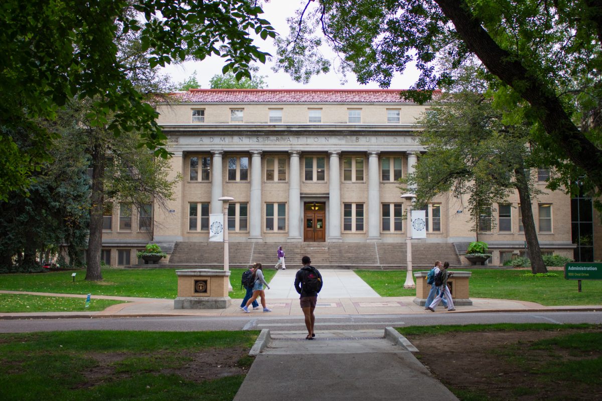 Students walk in front of Colorado State University's Administration building Sept. 14. 