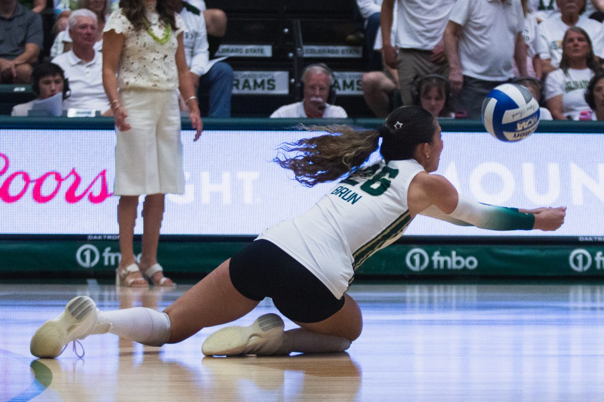 Maria Brun (26) dives for the ball during the third set of Colorado State University volleyball's white-out match against the University of Colorado, Boulder in Moby Arena Sept. 18. The second night of the double-header brought victory for the Rams, who came back to sweep the Buffaloes and win the golden spike after a night one loss.