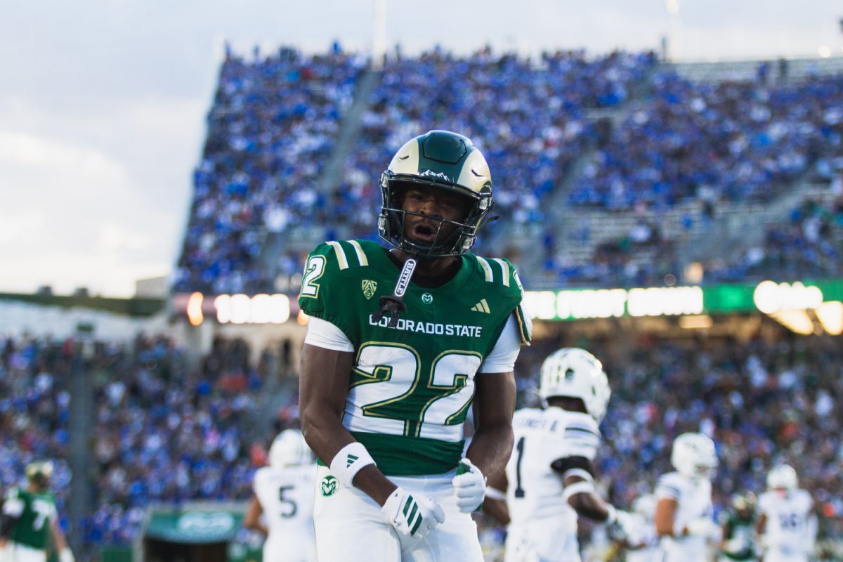 Running back Cedric Ross (22), a Colorado State University football player, celebrates a run during CSU's football game against Brigham Young University Sept. 19. CSU lost the game 41-23.