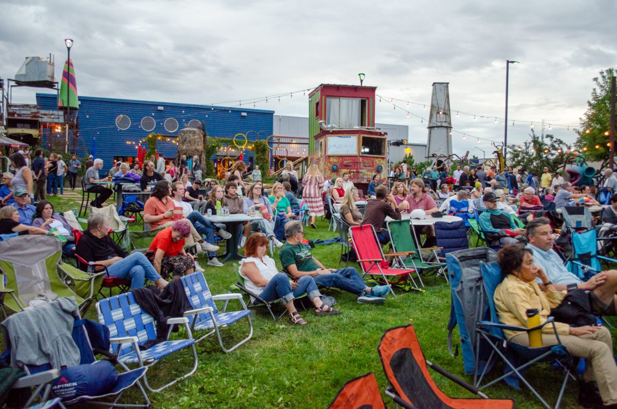A crowd gathers to watch the advance screening of The Weight at The Lyric’s outdoor theatre Aug. 31.
