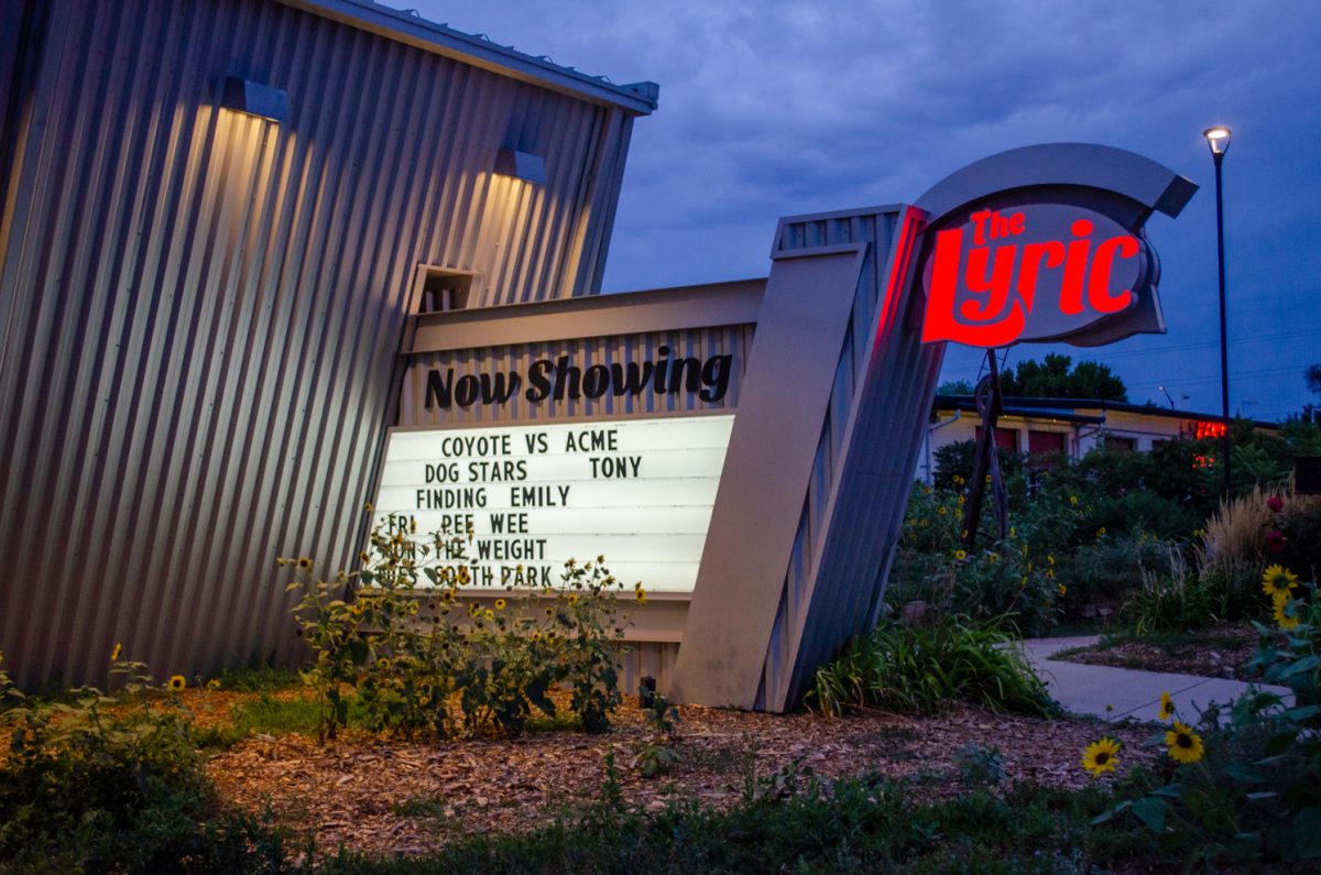A sign outside The Lyric Cinema advertises the advance screening for "The Weight" Aug. 31.