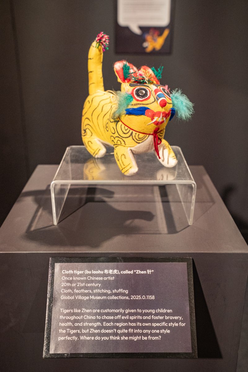 Cloth tiger (bu laohu) displays in the Work and Wonder exhibit inside of The Global Village Musuem of Arts and Cultures, in Fort Collins, CO Sept. 11. The description reads, “Tigers like Zhen are customarily given to young children throughout China to chase off evil spirits and foster bravery, health, and strength. Each region has its own specific style for the Tigers, but Zhen doesn’t quite fit into any one style perfectly. Where do you think she might be from?”