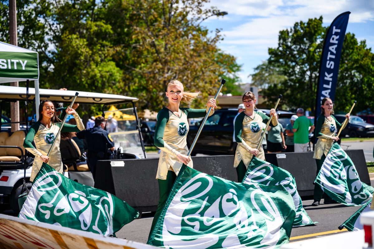 Colorado State University's color guard spins to face the crowd at the tailgate before the Border War in Canvas Stadium Sept. 5.