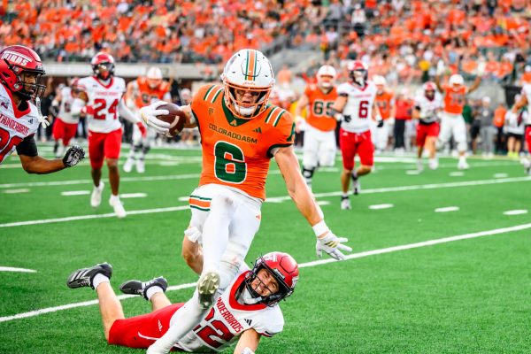 Colorado State University wide receiver Jackson Harper (6) vaults over a Southern Utah University defender to run to the end zone during CSU's Ag Day game Sept. 12. Harper put up 102 receiving yards for the Rams and scored CSU's second touchdown of seven. 