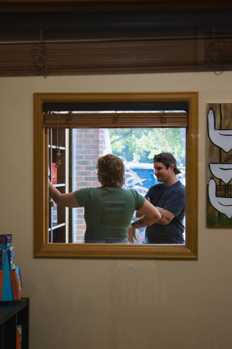 Braelen and Taylor Hunt browse for books at The Crowded Bookshelf, which celebrated its transition to being a brick and mortar bookstore Sept. 12. “ We wanted to patron ad support a queer-owned bookstore, and we love reading,” Braelen Hunt said, “We just finished up our books that we read before bed, so we needed something new to replace our bedtime routine. So we were like, this is perfect. We can come support a local business and get our bookworm needs met.”