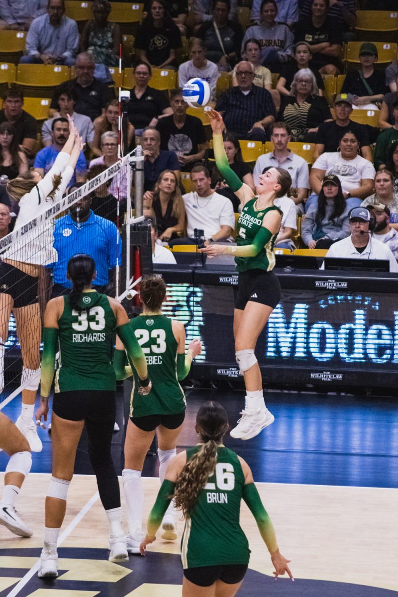 Colorado State University volleyball player Sofia Zabjek (5) follows through after spiking the ball over the net during CSU's away game against the University of Colorado, Boulder Sept. 17.