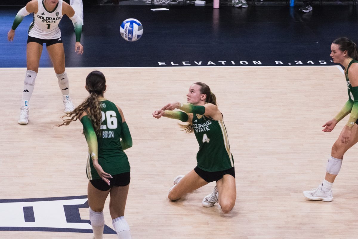 Halle Jameson (4), a sophomore on the Colorado State University volleyball team, prepares to return a serve during CSU's away game at the CU Events Center Sept. 17.