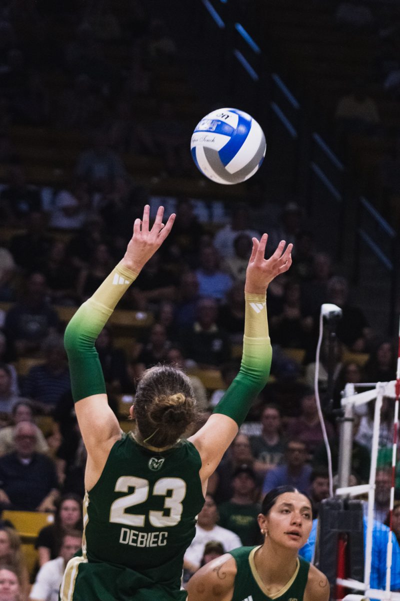 Erin Debeic (23), a Colorado State University volleyball player, sets the ball to a teammate during an away game against the University of Colorado, Boulder at the CU Events Center Sept. 17. Despite a night-one loss of 3-1, the Rams would go on to sweep the Buffaloes in Moby, and keep the golden spike home.