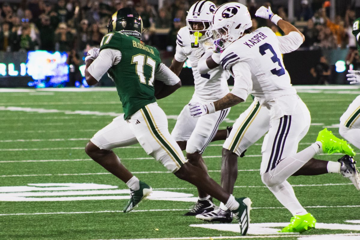 CJ Blocker Jr. (17), a player on the Colorado State University football team, carries the ball past Brigham Young University defense during CSU's game against BYU in Canvas Stadium Sept. 19. 