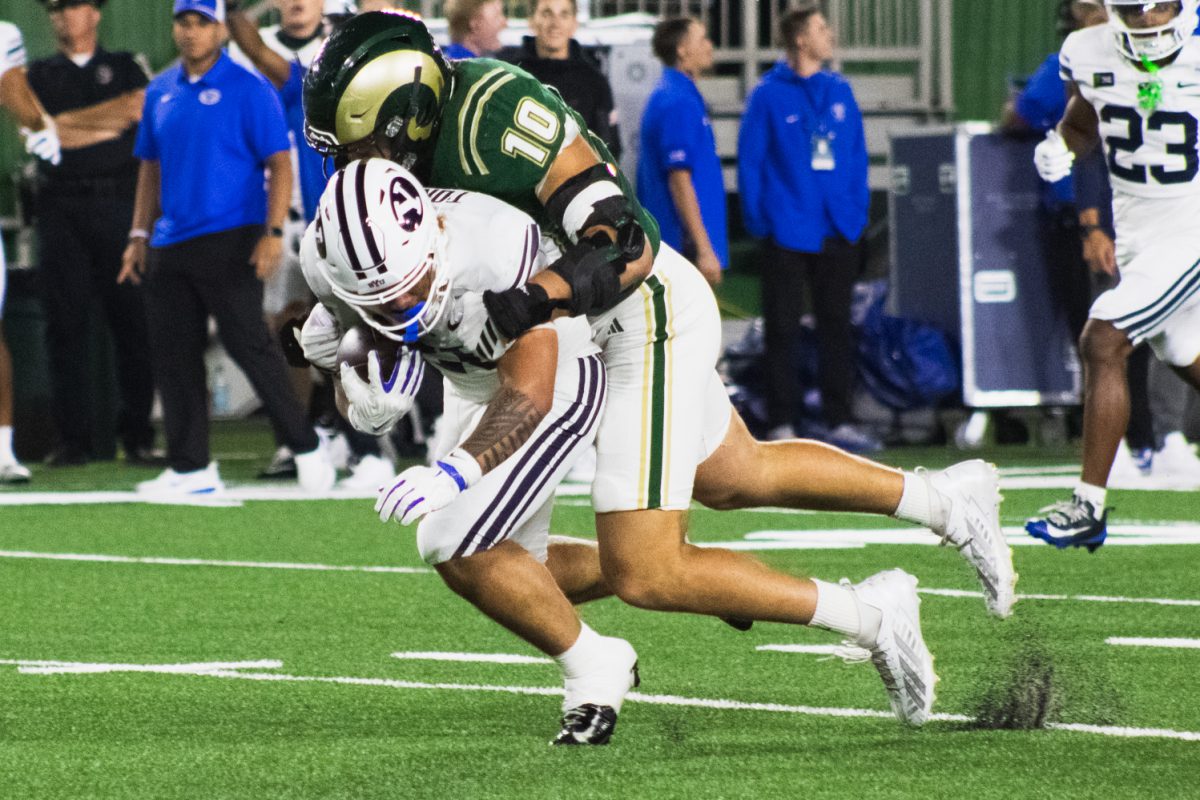 Colorado State University defensive lineman Brandon Kelley (10) tackles a Brigham Young University player during CSU's game against BYU in Canvas Stadium Sept. 19. CSU lost the game 41-23.