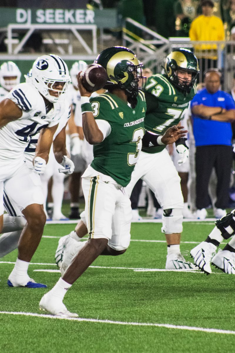 Colorado State University quarterback Darius Curry (3) lines up to throw the ball during the second half of CSU's football game against Brigham Young University Sept. 19.  Curry threw for 70 yards, including one touchdown pass to Nader Chirchi (88).