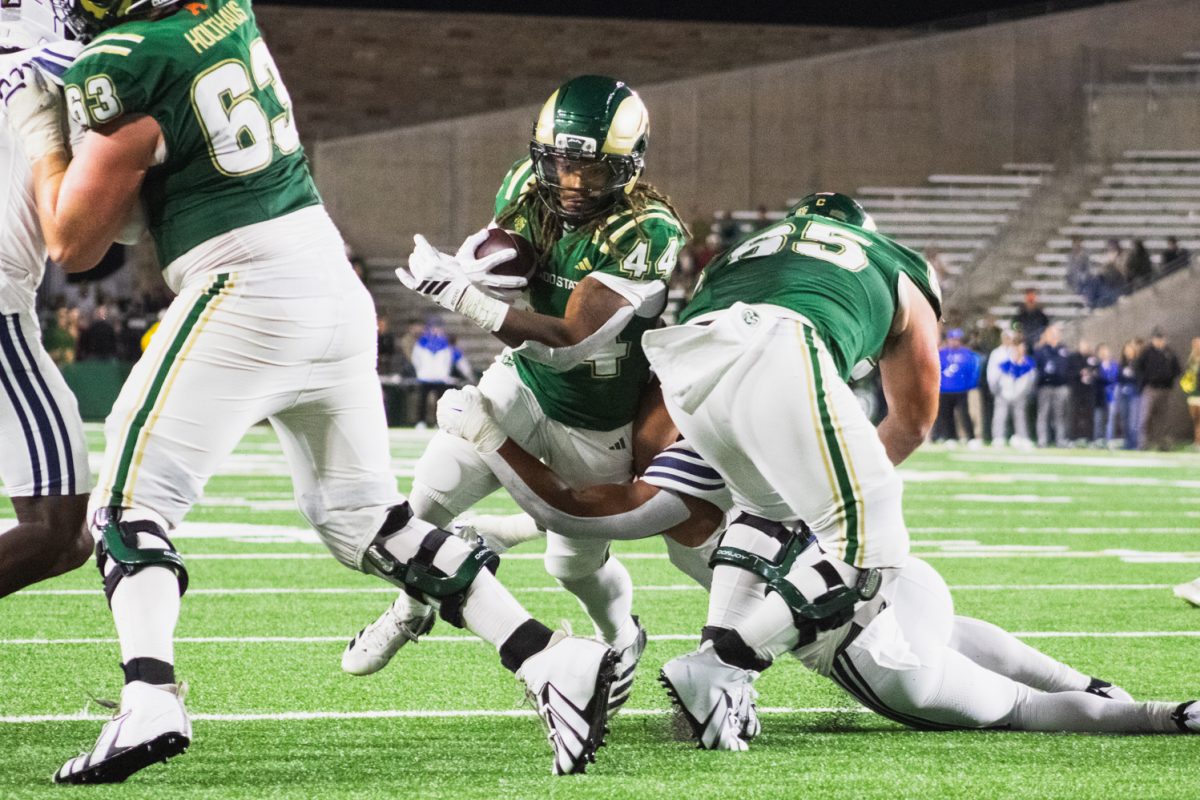 Colorado State University football running back Oliver Lundberg (44) runs with the ball during a drive in the second half of CSU's game against Brigham Young University Sept. 19.